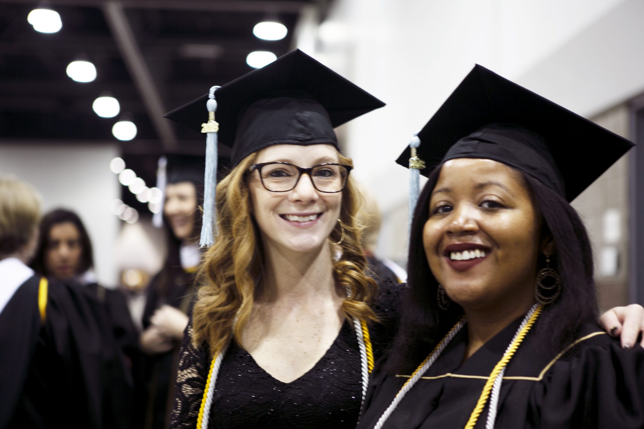 image of two undergraduate students at fall commencement 2018