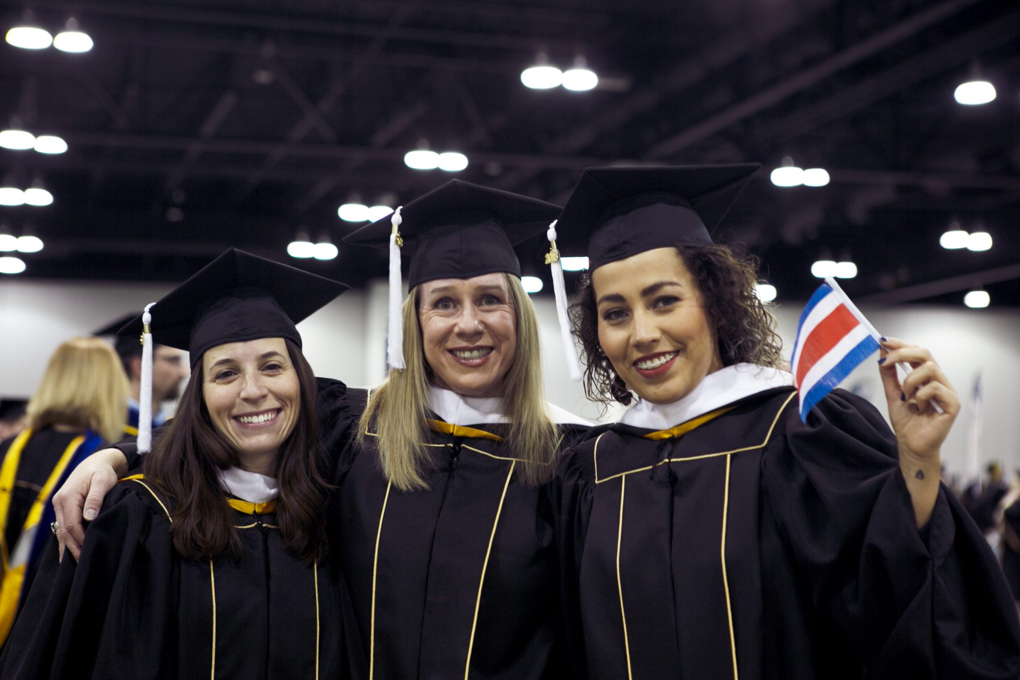 Image of three SEHD grad students at fall commencement 2018