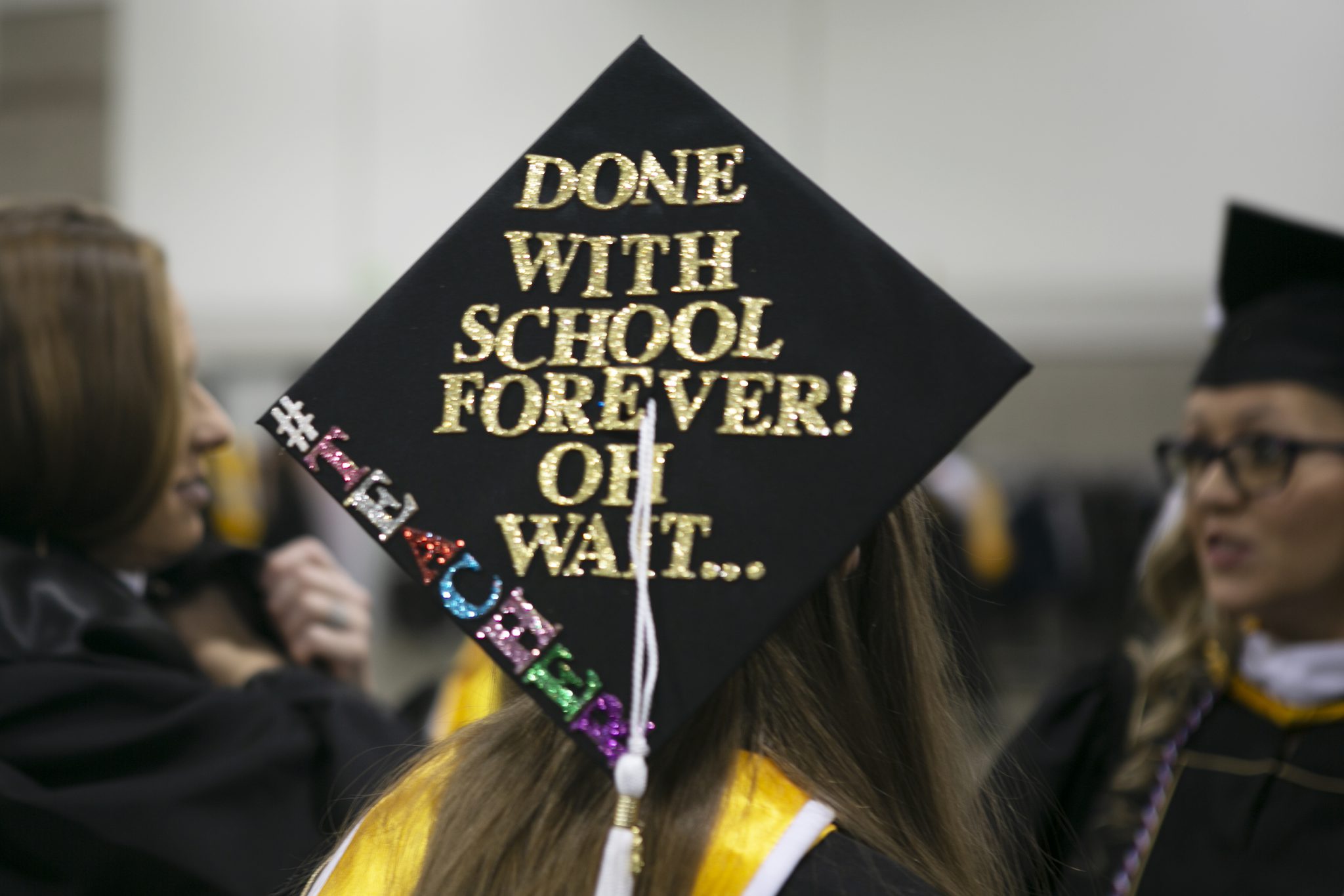 Student graduation cap that say "done with schoo forever! Oh wait...#teacher"