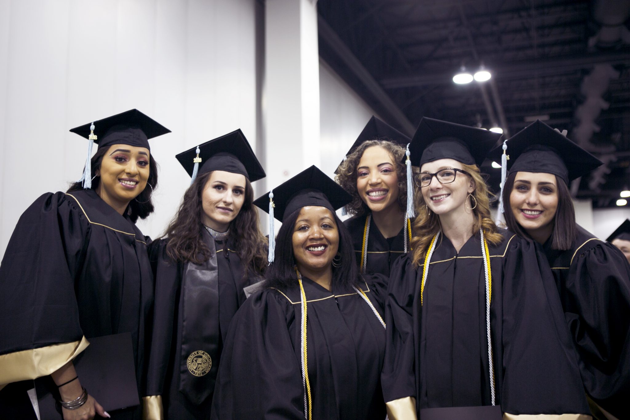 six undergraduate cohort members in group photo at fall commencement 2018