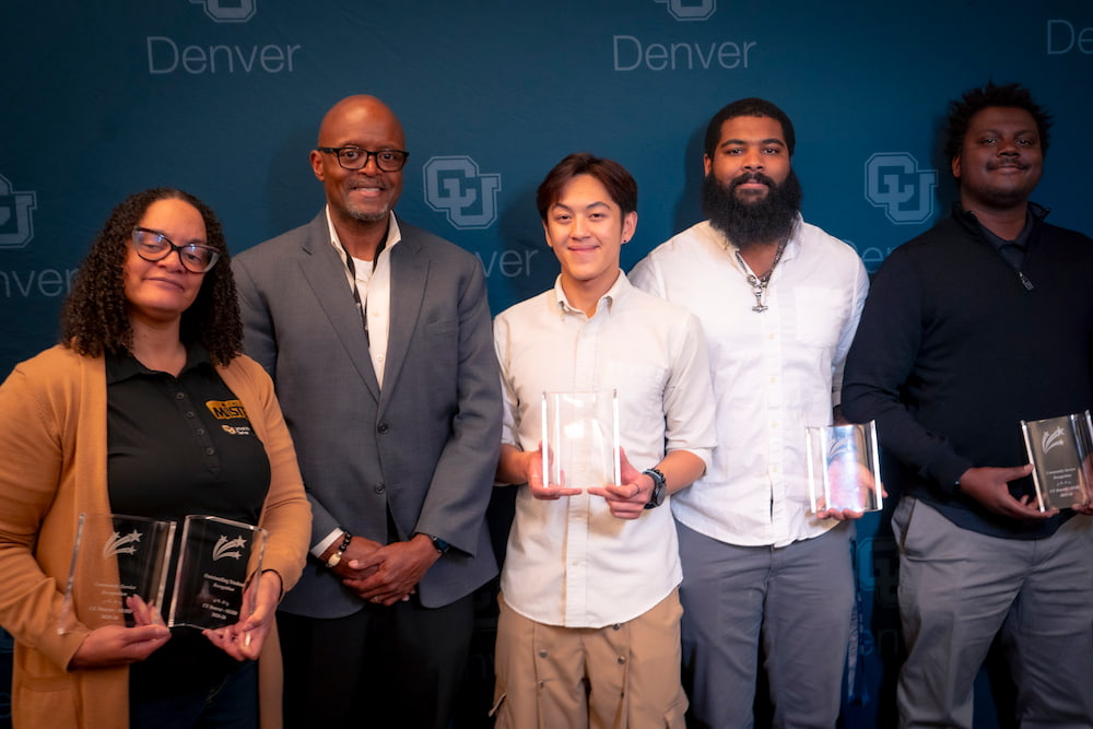 U Denver MISTERs honored at the Spring 2026 Undergraduate Recognition Celebration. Left to right: CMM Program Director Dr. Geneva Sarcedo (who is holding awards for Diego Lucero and Tony Tasayco, not pictured), SEHD Dean Dr. Marvin Lynn, Vincent Vuong, Kori Curtis. and Tramane Hudson.